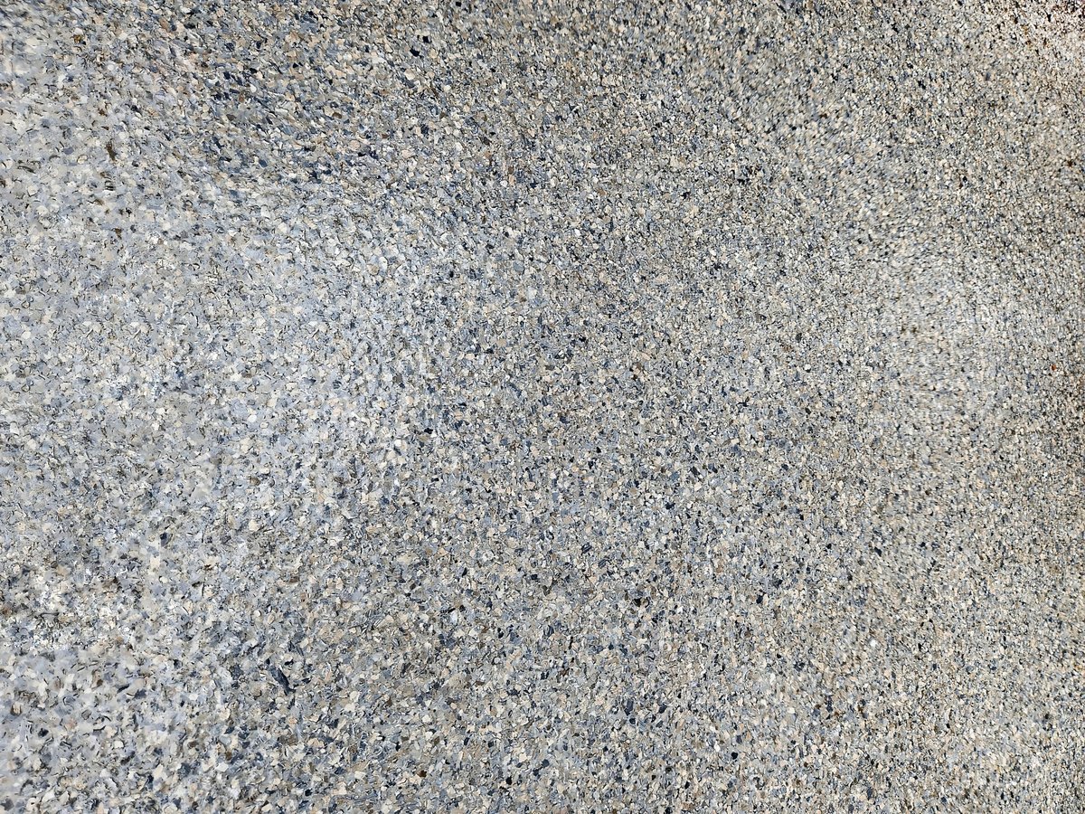 Decorative flake finish on a freshly coated garage floor showing a clean durable surface