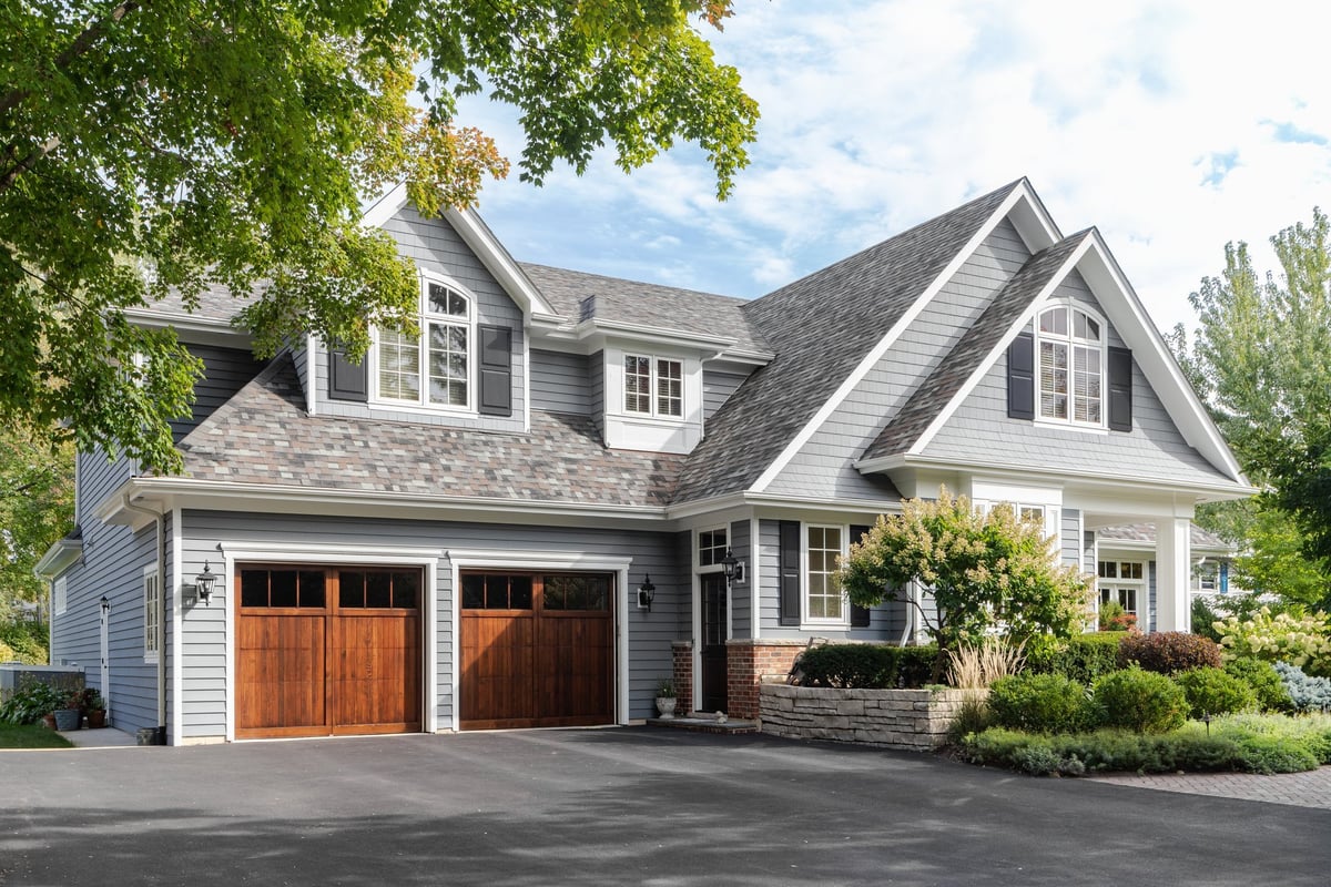 Garage door on a modern Gainesville home with landscaped yard