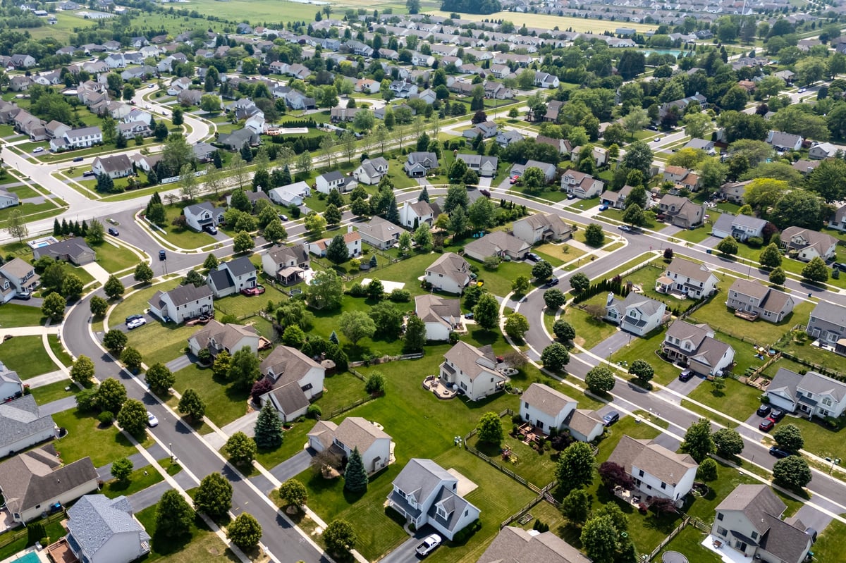 Residential neighborhood in suburban Nocatee Florida with new single family homes, tree lined streets and green space
