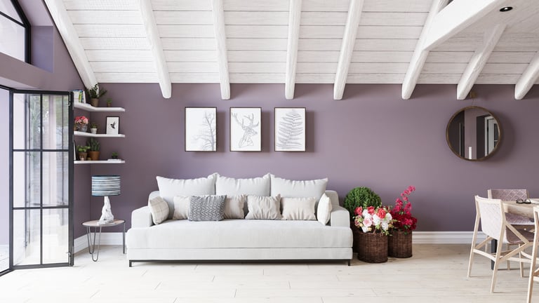 Modern living room with gray sofa and dusty purple walls